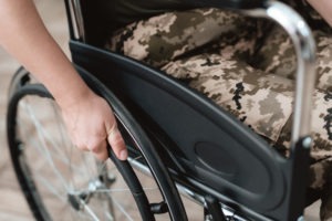 close-up on veteran in a wheelchair